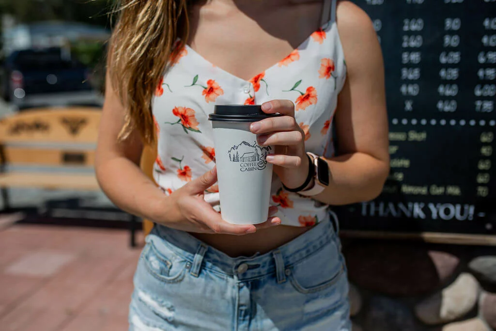 Girl holding coffee cup