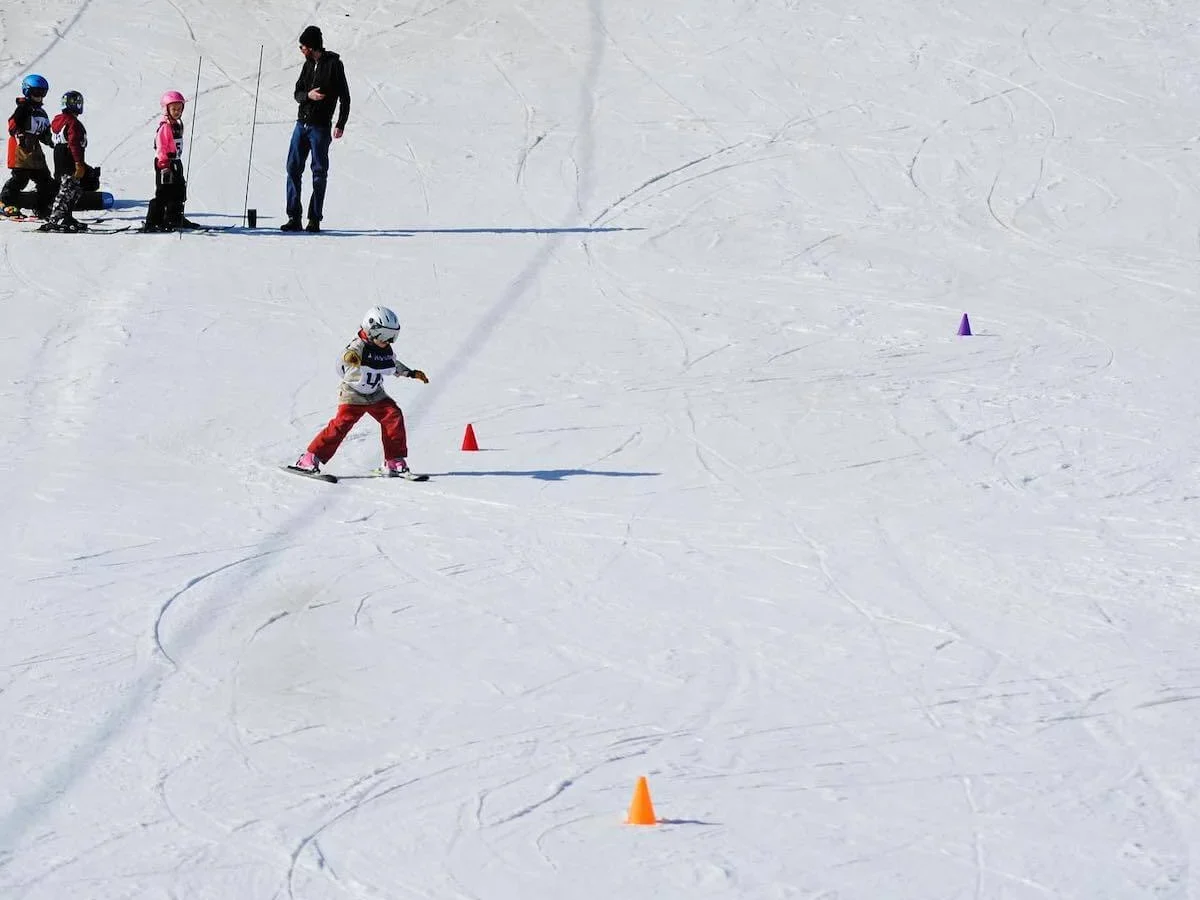 Young skier navigating cones