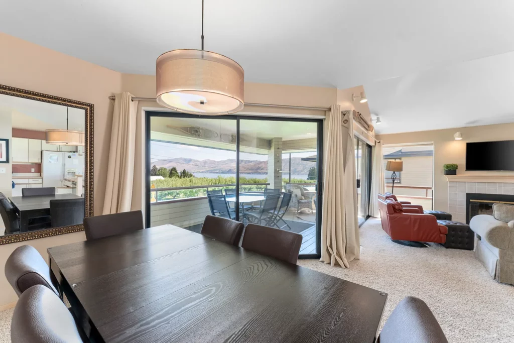 Living room looking through glass doors to patio