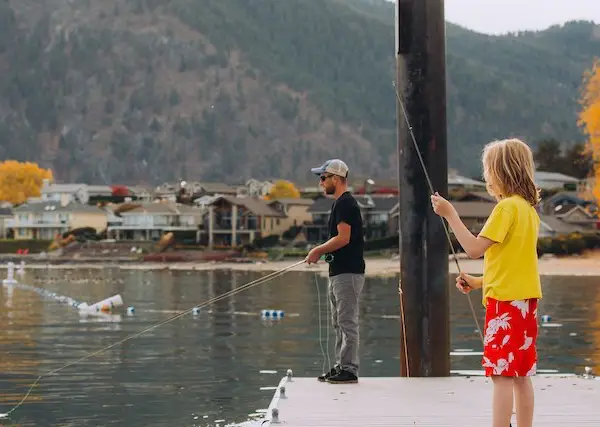 A dad and a daughter fishing