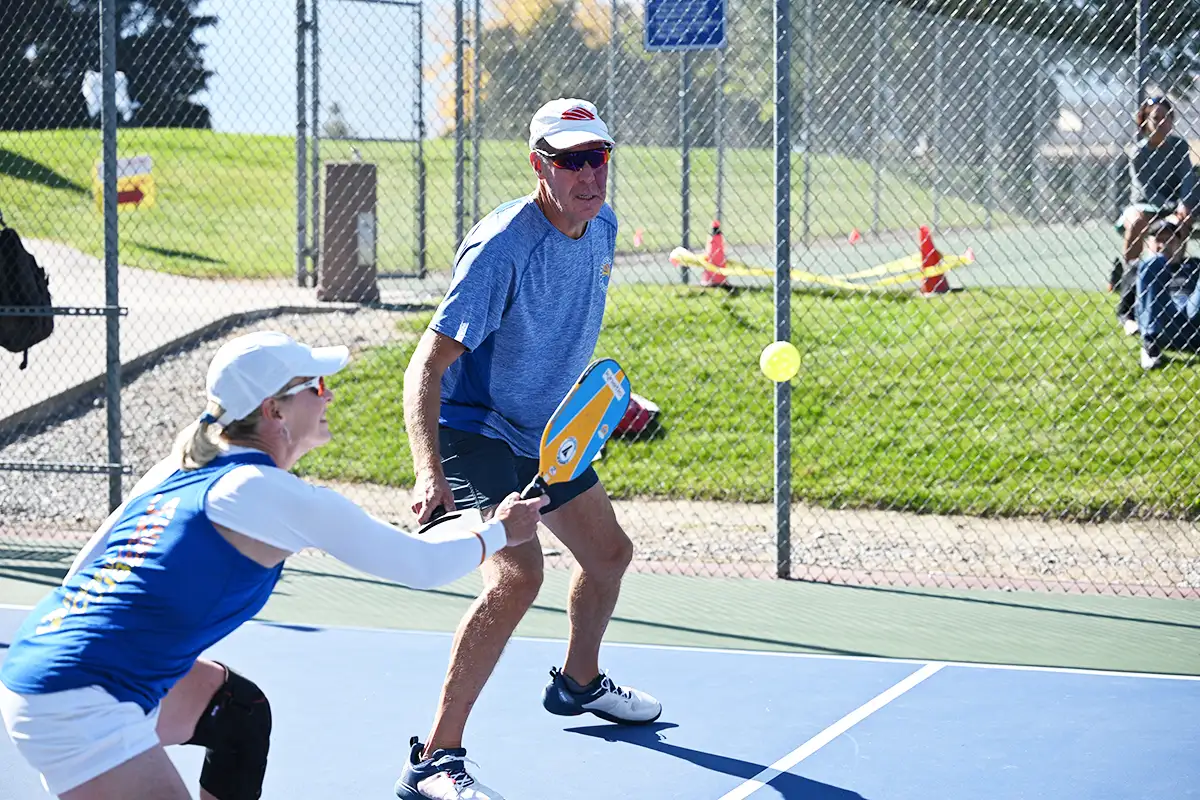 A couple playing pickle ball